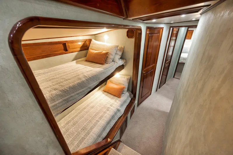 Knot Now Yacht Photos Pics Luxurious 1997 Miller Marine Custom Carolina yacht interior with cozy bunk beds and elegant wood finish.