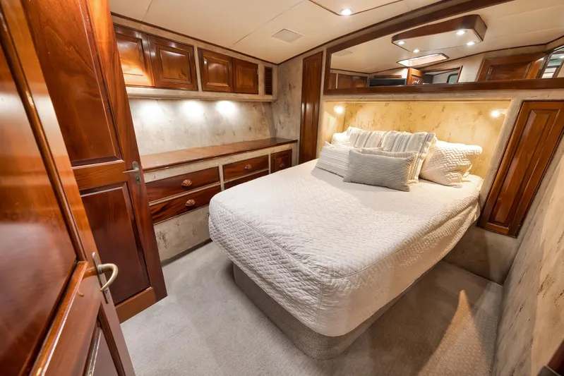 Knot Now Yacht Photos Pics Luxurious cabin interior of 1997 Miller Marine Custom Carolina yacht with elegant wood finishes.