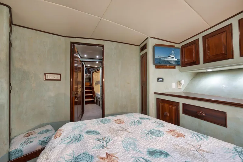 Knot Now Yacht Photos Pics Luxurious 1997 Miller Marine Custom Carolina yacht bedroom with elegant wood cabinetry and nautical decor.