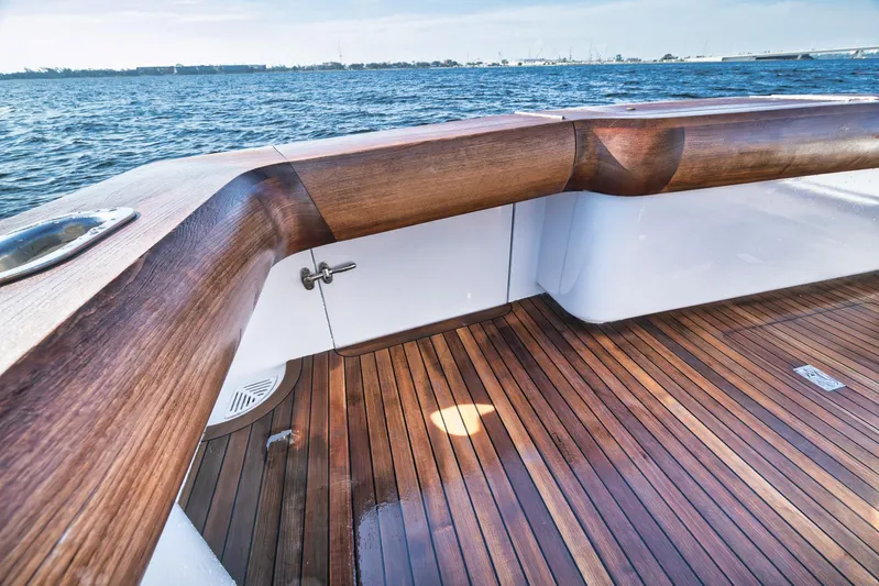 Knot Now Yacht Photos Pics Teak deck of 1997 Miller Marine Custom Carolina boat with ocean view.