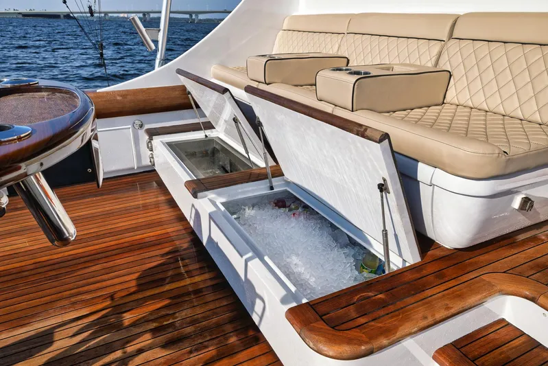 Knot Now Yacht Photos Pics Luxurious 1997 Miller Marine Custom Carolina yacht deck with seating and built-in coolers.