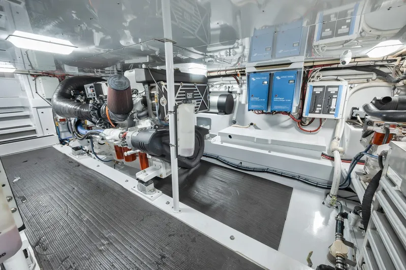 Knot Now Yacht Photos Pics Engine room of 1997 Miller Marine Custom Carolina boat, featuring advanced machinery and equipment.