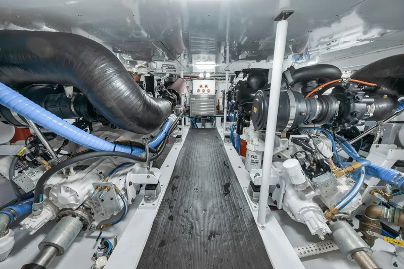 Knot Now Yacht Photos Pics Engine room of 1997 Miller Marine Custom Carolina boat, showcasing machinery and components.