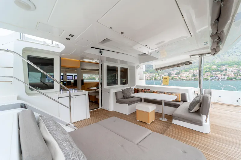  Yacht Photos Pics Spacious 2015 Lagoon 52 F yacht interior with modern seating and scenic views.