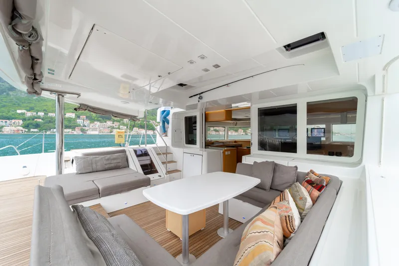  Yacht Photos Pics Spacious 2015 Lagoon 52 F yacht interior with comfortable seating and dining area.