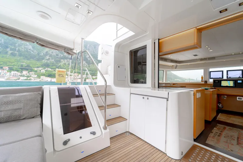  Yacht Photos Pics Luxurious interior of 2015 Lagoon 52 F catamaran with modern design and scenic views.