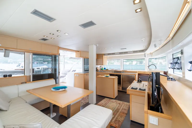  Yacht Photos Pics Luxurious interior of 2015 Lagoon 52 F yacht with modern kitchen and seating area.