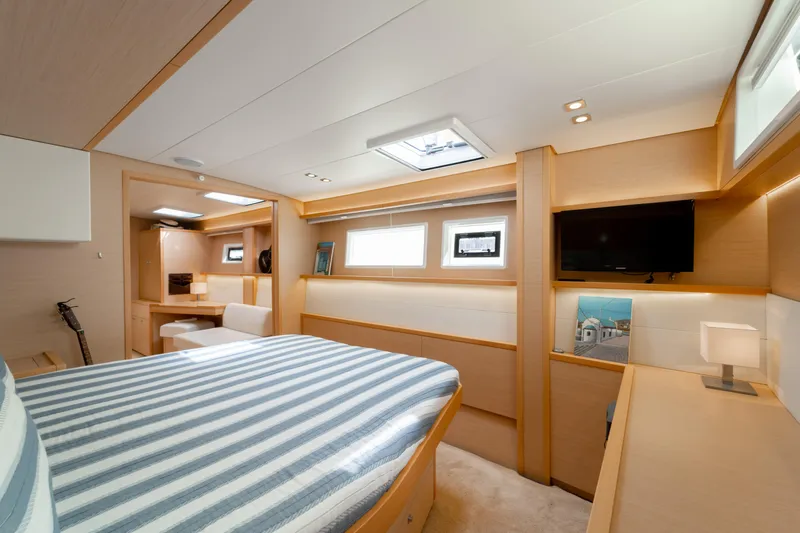  Yacht Photos Pics Luxurious cabin interior of 2015 Lagoon 52 F yacht with modern amenities and stylish design.
