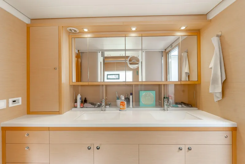  Yacht Photos Pics Luxurious bathroom in 2015 Lagoon 52 F yacht with dual sinks and mirrored cabinets.
