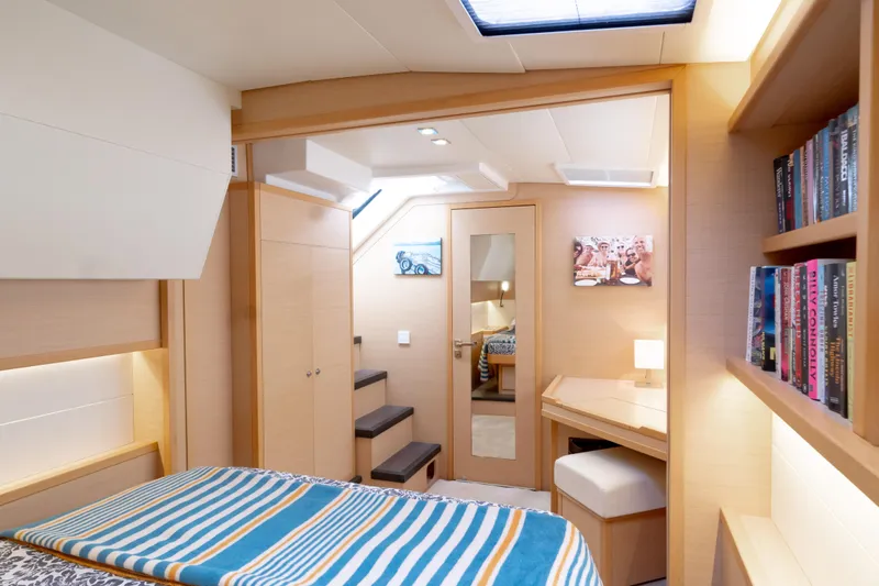  Yacht Photos Pics Luxurious interior of 2015 Lagoon 52 F yacht cabin with modern decor and cozy furnishings.