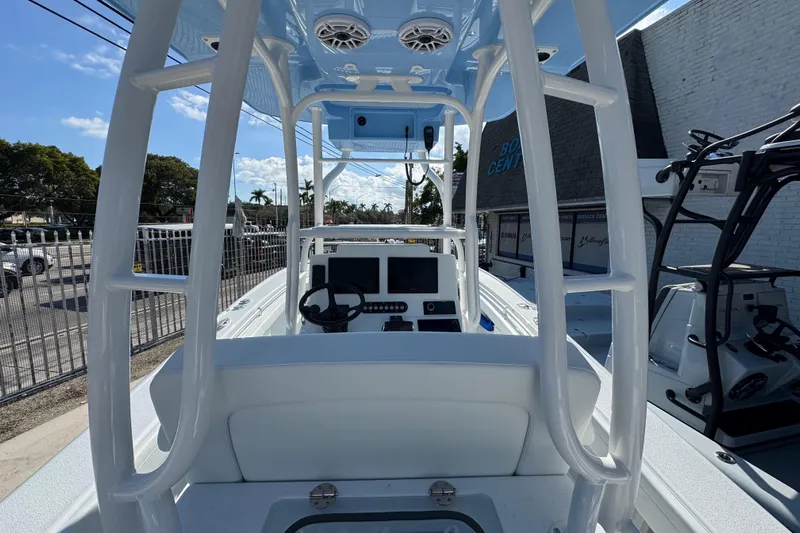  Yacht Photos Pics 2026 Yellowfin 26 Hybrid boat interior with steering console and navigation screens.