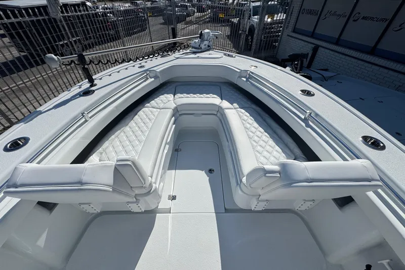  Yacht Photos Pics 2026 Yellowfin 26 Hybrid boat interior with white cushioned seating and sleek design.