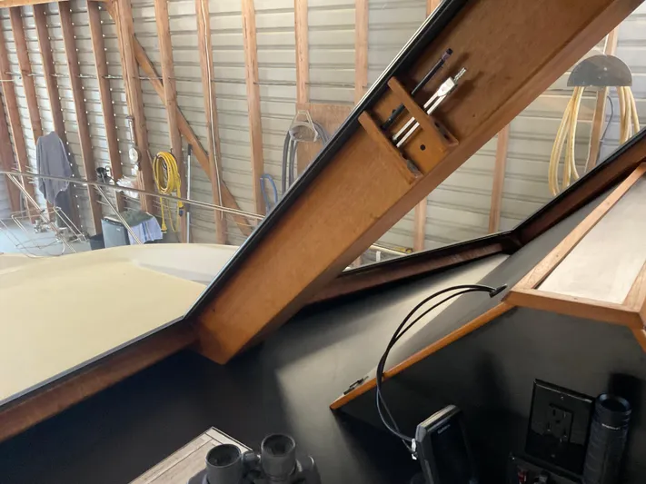  Yacht Photos Pics Interior view of a 1991 Nordic Pilothouse boat with wooden accents and equipment.