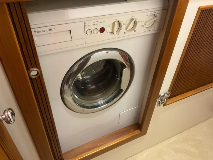  Yacht Photos Pics Washing machine in a 1991 Nordic Pilothouse, built-in wooden cabinet.
