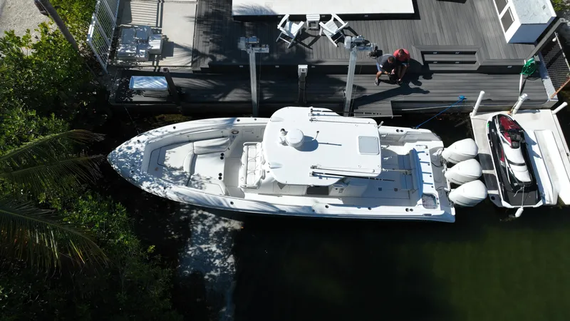  Yacht Photos Pics Aerial view of 2008 Everglades 350 CC boat docked beside a wooden pier.