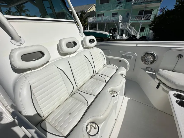  Yacht Photos Pics 2008 Everglades 350 CC boat interior with white seating and cup holders.