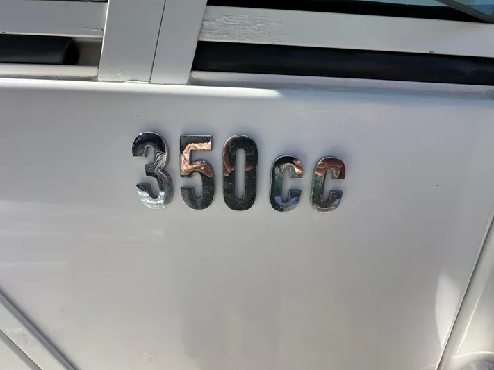  Yacht Photos Pics Everglades 350 CC boat emblem, 2008 model, metallic lettering on white surface.
