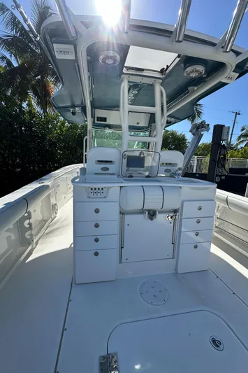  Yacht Photos Pics 2008 Everglades 350 CC boat interior with helm station and storage compartments.