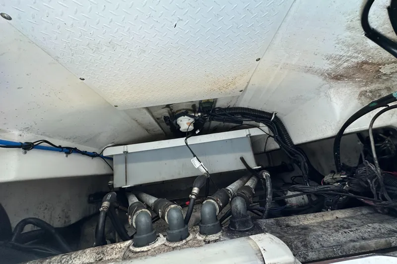  Yacht Photos Pics Engine compartment of a 2008 Everglades 350 CC boat, showing wiring and hoses.