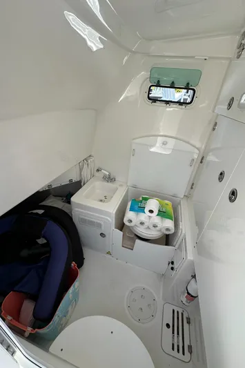  Yacht Photos Pics 2008 Everglades 350 CC boat interior with compact bathroom and storage.
