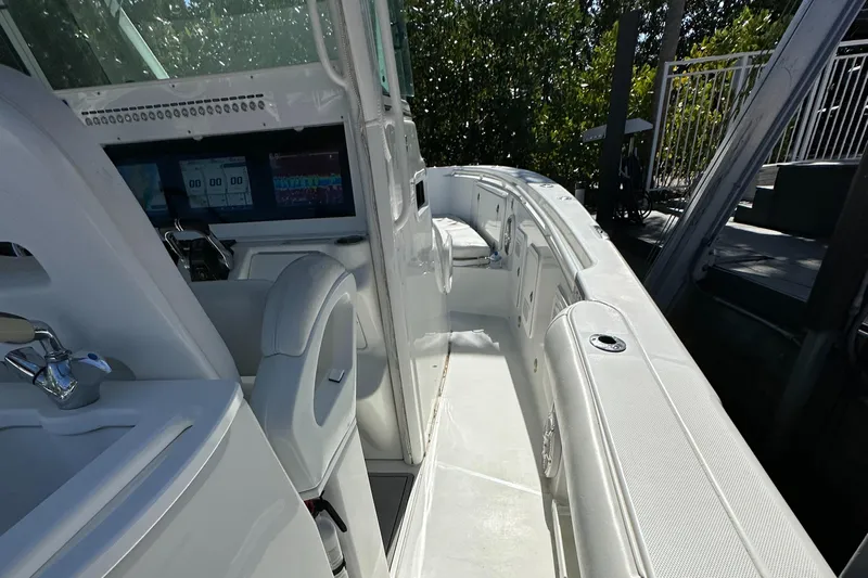  Yacht Photos Pics 2008 Everglades 350 CC boat interior with sleek white seating and modern controls.