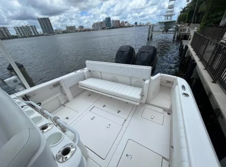 Gin Fizz Yacht Photos Pics 2012 Intrepid 327 boat with spacious deck, dual engines, and waterfront view.