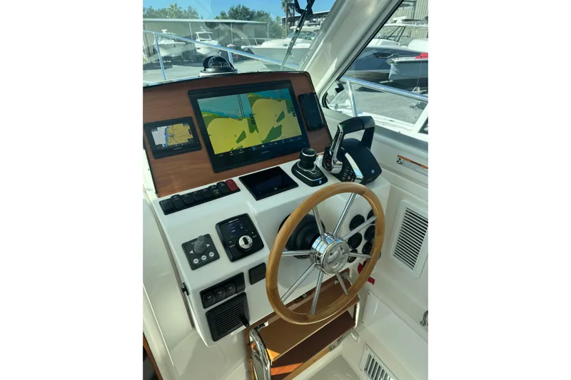  Yacht Photos Pics Helm of 2024 Back Cove 34O with navigation screens and controls.