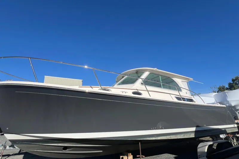  Yacht Photos Pics 2024 Back Cove 34O boat with sleek design under clear blue sky.