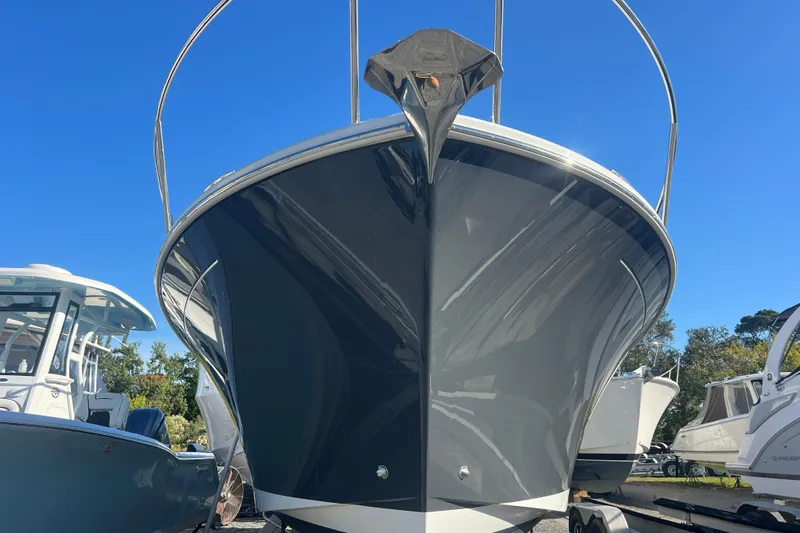  Yacht Photos Pics 2024 Back Cove 34O boat with sleek gray hull, displayed outdoors under clear blue sky.