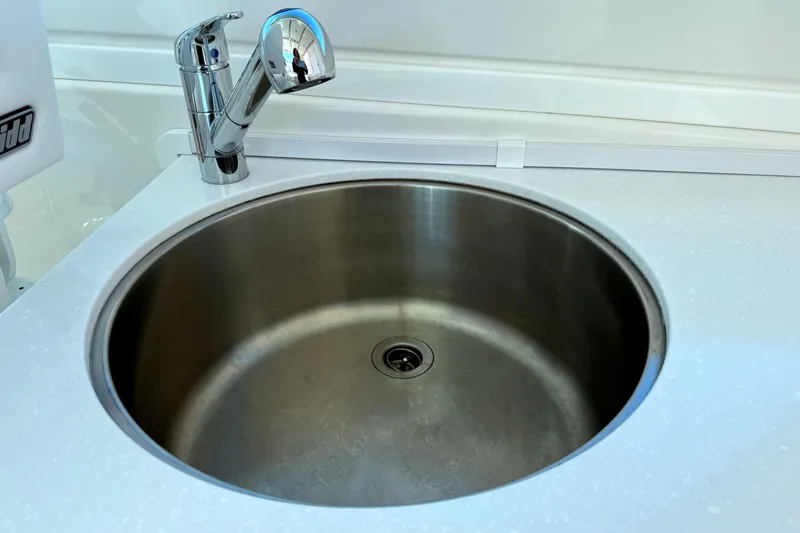  Yacht Photos Pics Stainless steel sink with modern faucet on 2024 Back Cove 34O boat.