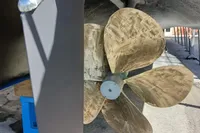 Propeller and rudder of a 2004 Custom Line 94 yacht, with maintenance supplies nearby.