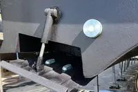 Close-up of a 2004 Custom Line 94 yacht's hull and hydraulic mechanism.
