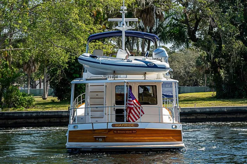 Hayride Yacht Photos Pics 2013 Grand Banks 43 Europa yacht with dinghy, cruising on a scenic waterway.