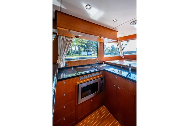 Hayride Yacht Photos Pics Luxurious kitchen interior of 2013 Grand Banks 43 Europa yacht with modern appliances.