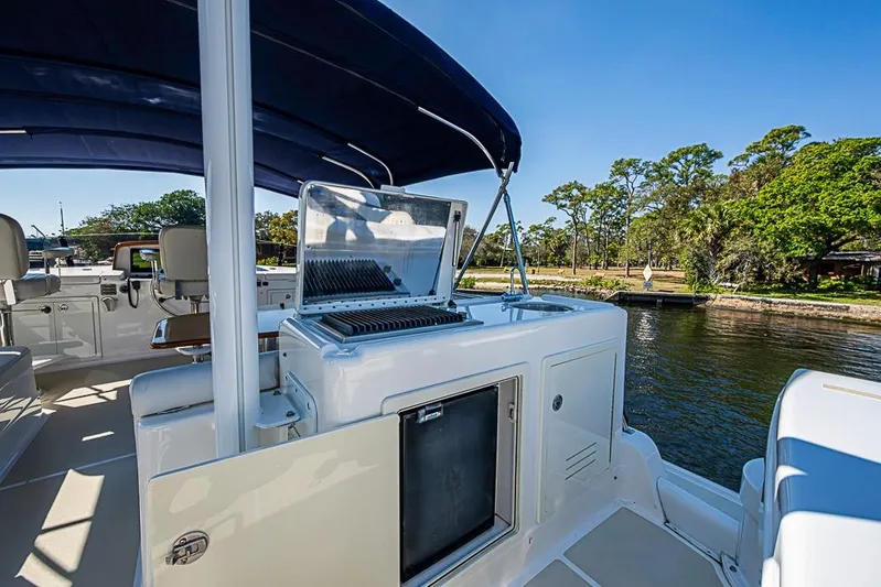 Hayride Yacht Photos Pics 2013 Grand Banks 43 Europa yacht with outdoor grill and seating area.