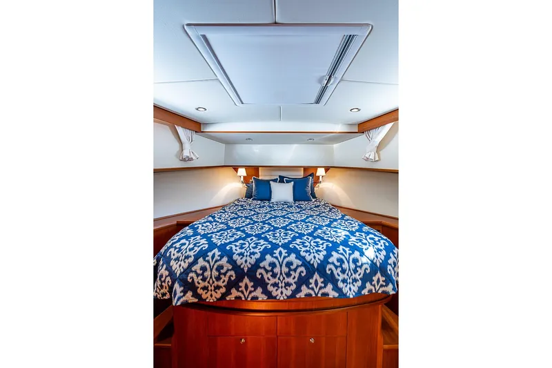 Hayride Yacht Photos Pics Luxurious cabin interior of 2013 Grand Banks 43 Europa yacht with elegant bedding.