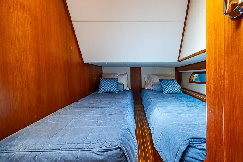 Hayride Yacht Photos Pics Cabin interior of 2013 Grand Banks 43 Europa with twin beds and blue bedding.