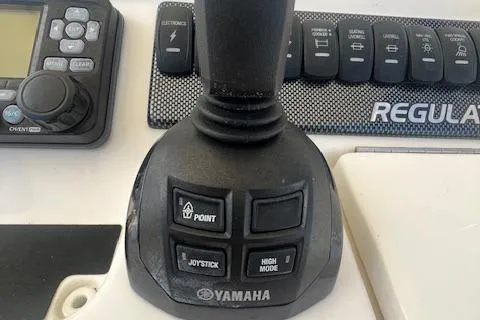  Yacht Photos Pics Yamaha joystick control on 2017 Regulator 31 boat dashboard with navigation buttons.