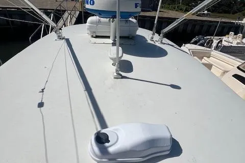  Yacht Photos Pics 2017 Regulator 31 boat deck with radar and equipment in a marina setting.