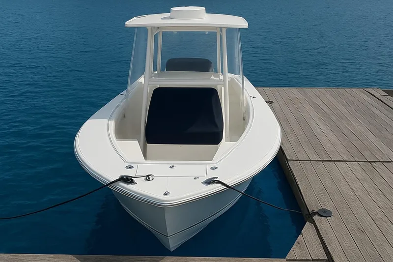  Yacht Photos Pics 2017 Regulator 31 boat docked on calm blue water.