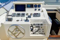 Helm of 2004 Custom Line 94 yacht with navigation instruments and controls.