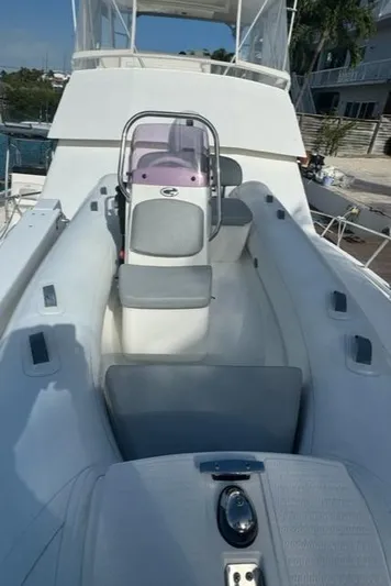  Yacht Photos Pics 1998 Viking 43 Convertible boat deck with seating and control console.