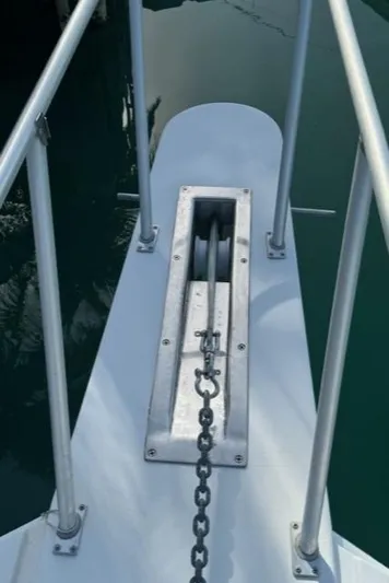  Yacht Photos Pics Bow of 1998 Viking 43 Convertible with anchor chain and railing.