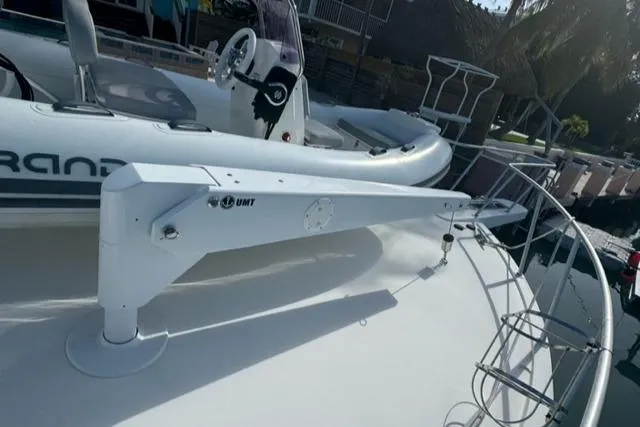  Yacht Photos Pics 1998 Viking 43 Convertible yacht with UMT davit and inflatable boat on deck.