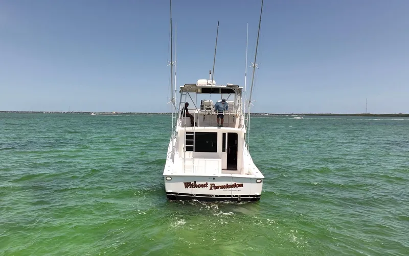  Yacht Photos Pics 1998 Viking 43 Convertible boat on open water, rear view, clear sky.
