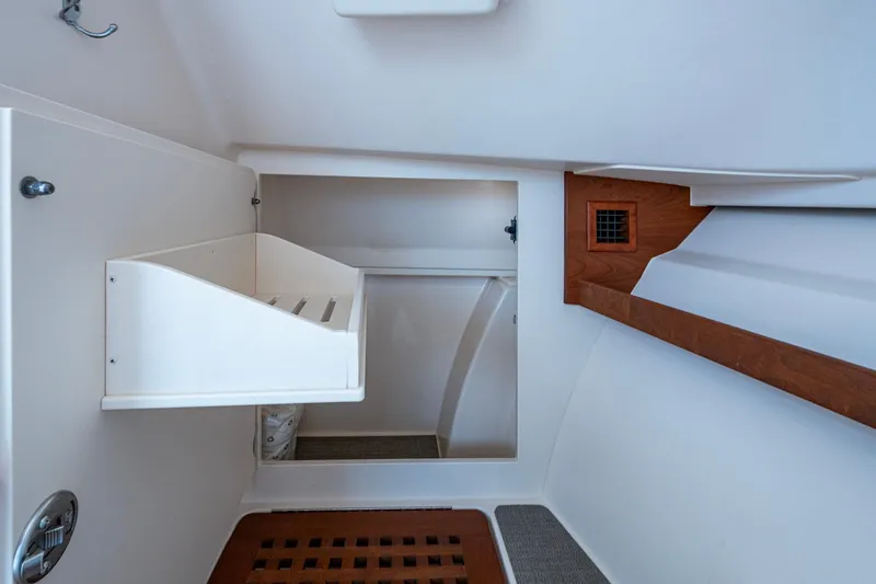  Yacht Photos Pics 2017 Grady-White Freedom 335 interior storage compartment with wooden accents.