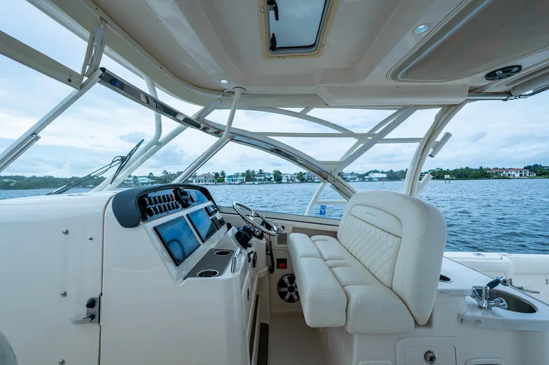  Yacht Photos Pics 2017 Grady-White Freedom 335 boat interior with luxurious seating and modern dashboard.