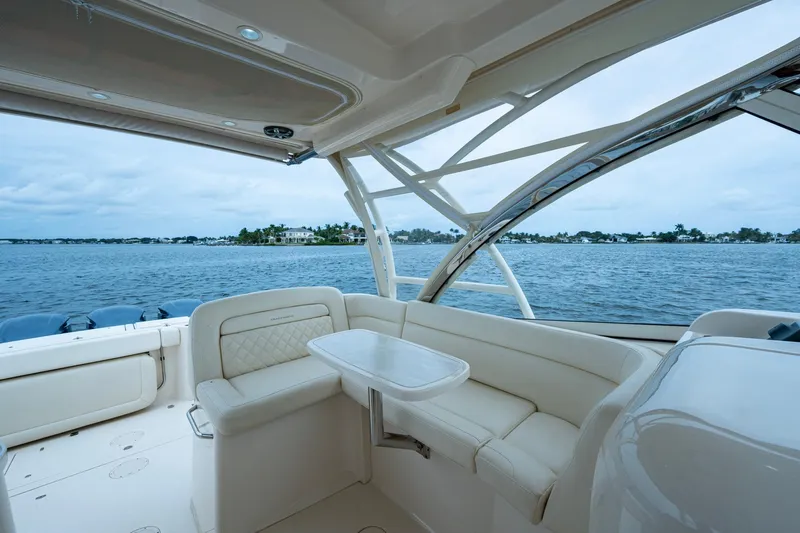  Yacht Photos Pics 2017 Grady-White Freedom 335 boat interior with ocean view and comfortable seating.