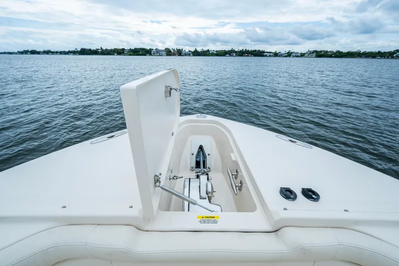  Yacht Photos Pics 2017 Grady-White Freedom 335 boat with open anchor hatch on calm water.