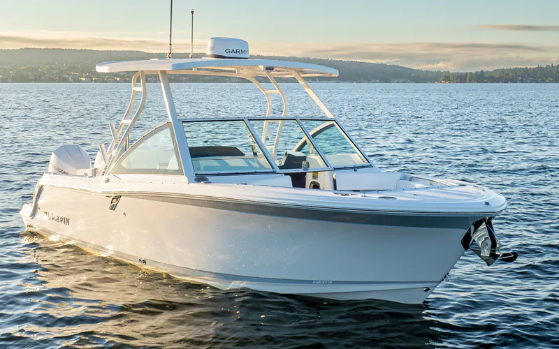  Yacht Photos Pics 2024 Blackfin 252 DC boat on calm water at sunset.